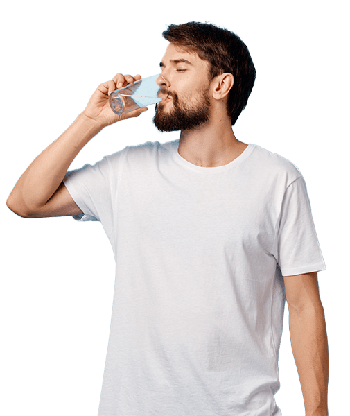 man with a beard drinking water